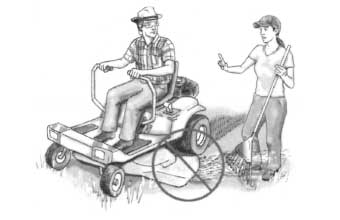 Person standing in the path of a riding lawn mower
