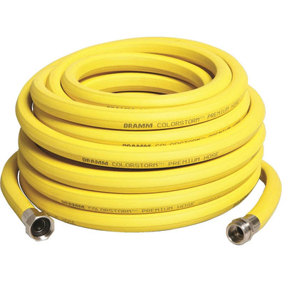 A coiled yellow rubber water hose with nickel plated brass fittings.