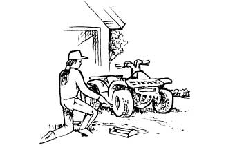 Person repairing ATV