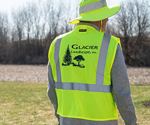 Man in high-vis vest with company logo