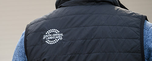 Embroidered logon on black vest