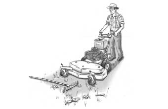 Person using a zero turn mower with debris in the path of the mower