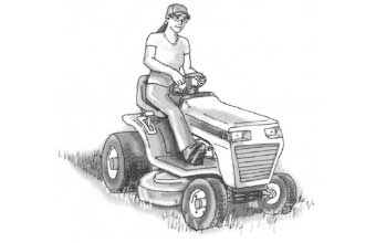 Person driving a riding lawn mower