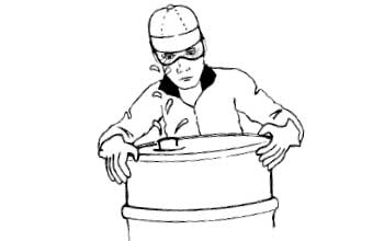 Person wearing googles and liquid splashing out of barrel
