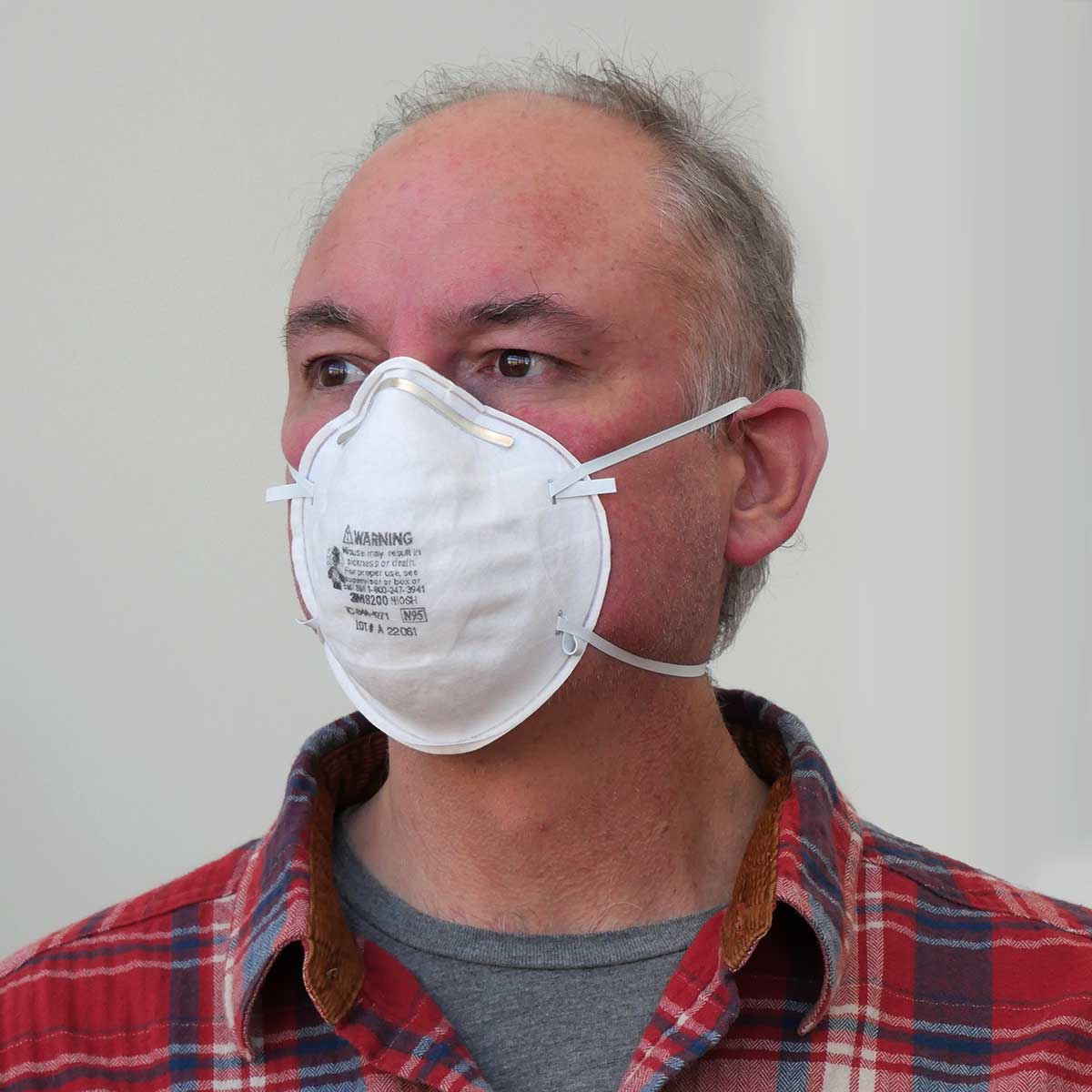 Person wearing a 3M 8200 N95 Series Particulate Respirator