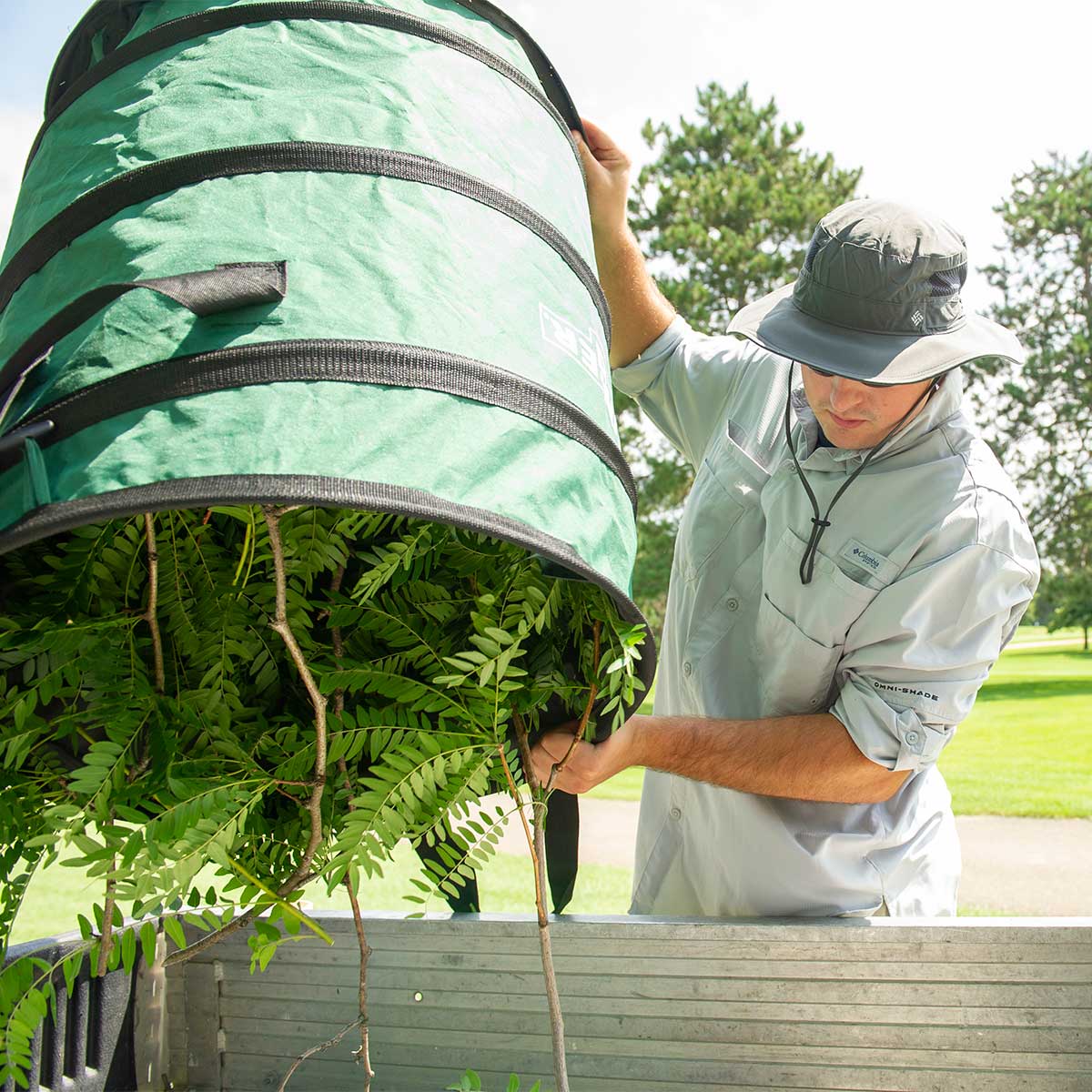 Unger Collapsible Trash Can and Landscaping Bag in use