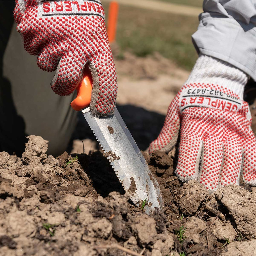 Seymour® Landscaper Knife, 6.5" Blade, W/ Sheath being used to dig