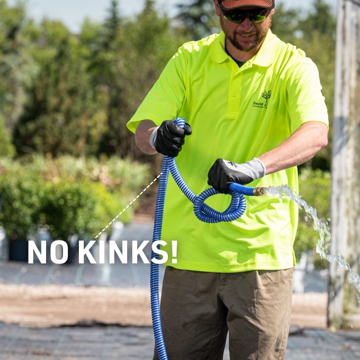 Man using blue garden hose featuring "no kinks"