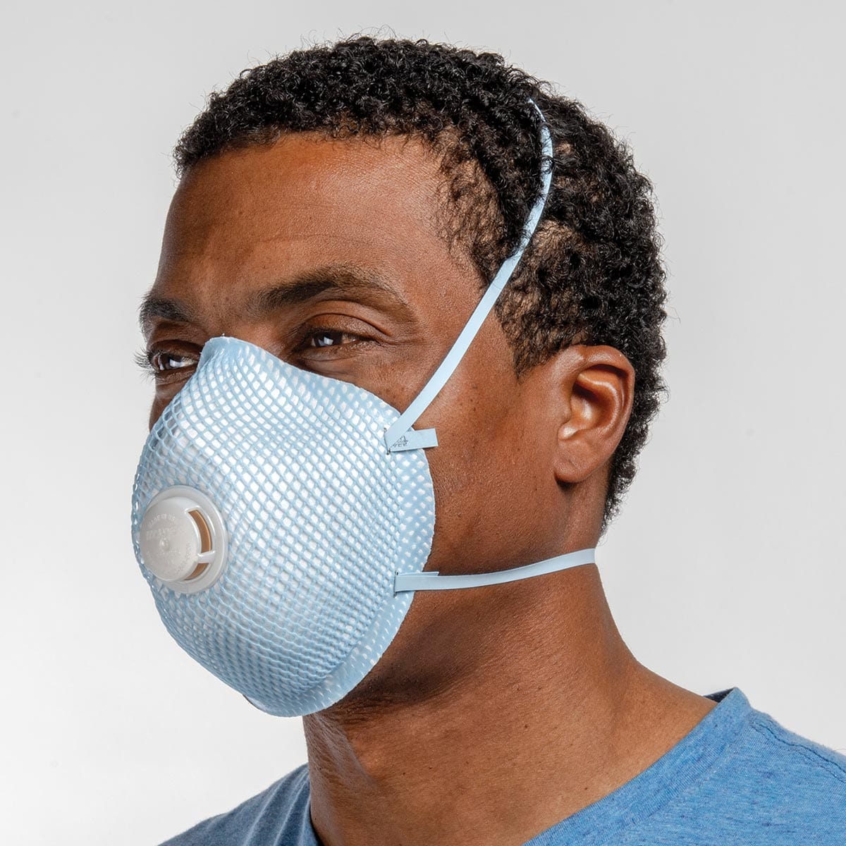 Man wearing a Moldex 2300 N95 filtering facepiece respirator