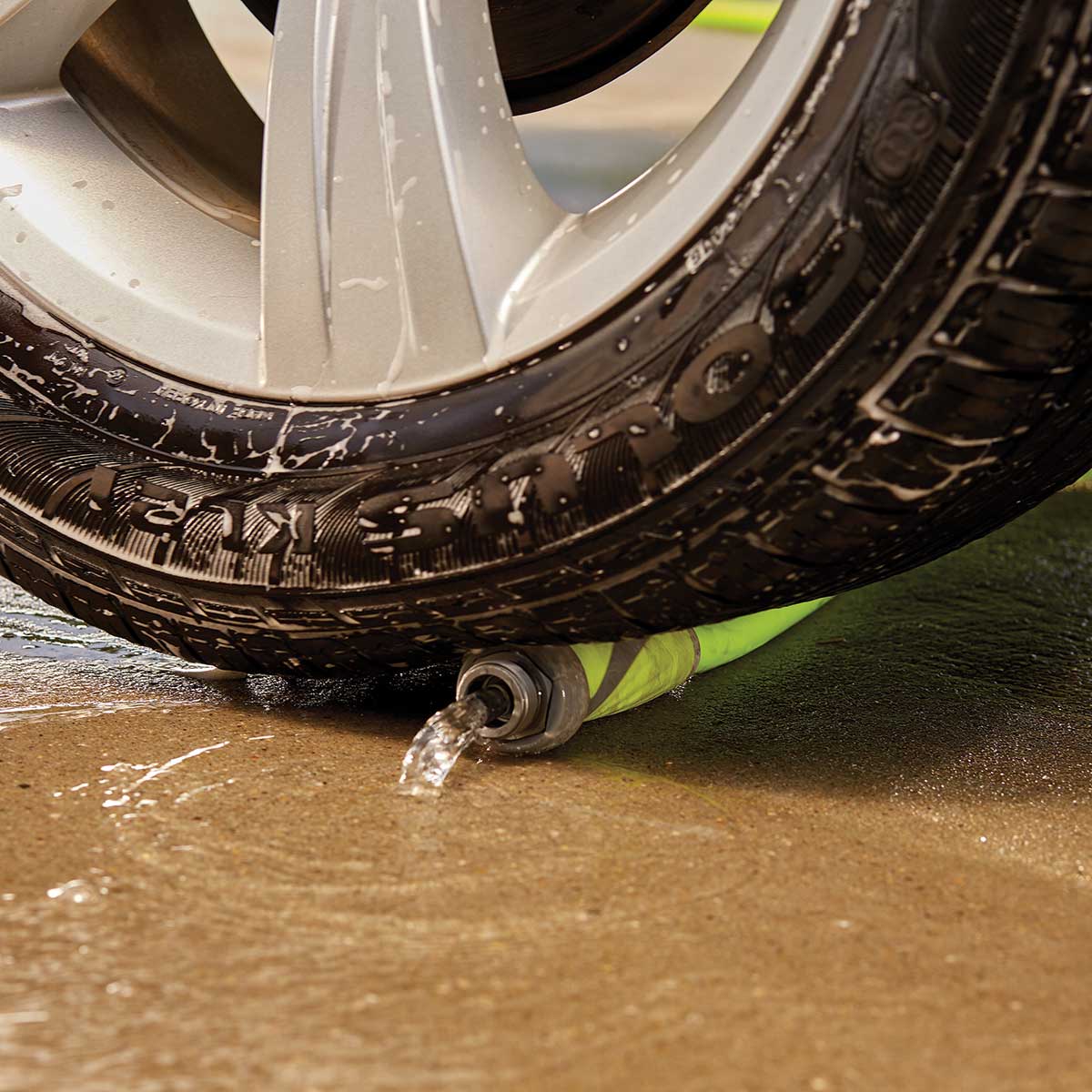 Flexzilla hose showing strength by being run over by a car.