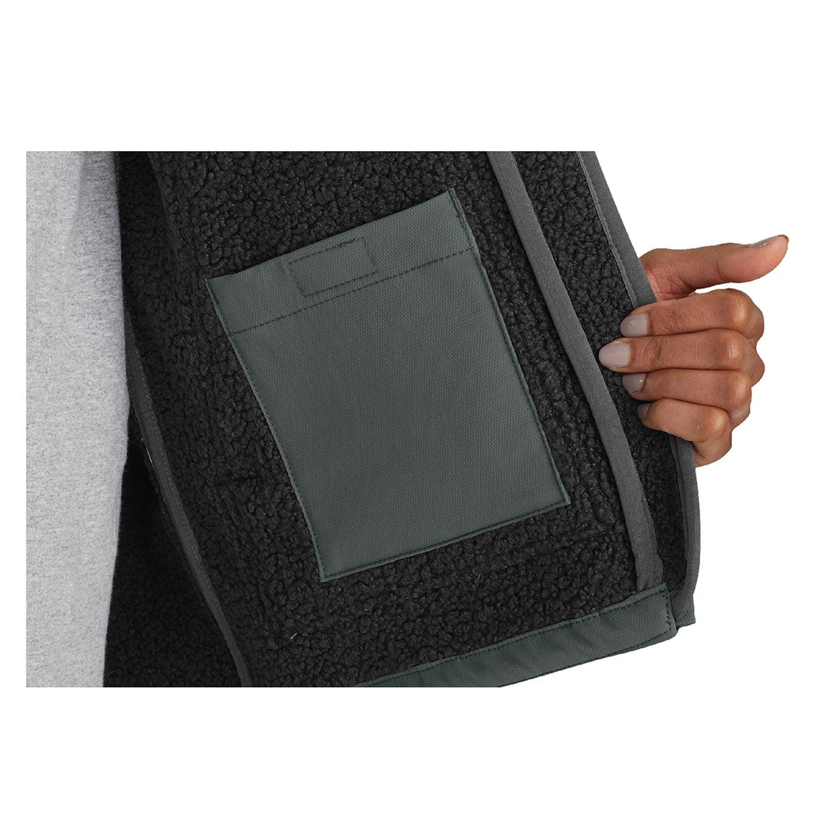 Closeup of the pocket on the Carhartt Women's Super Dux Relaxed Fit Sherpa-Lined Jacket