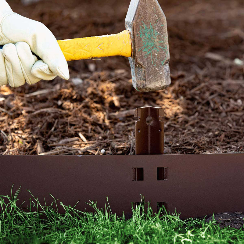 Closeup of a hammer stake from the Colmet 4" QuickLock 14-Gauge Steel Landscape Edging