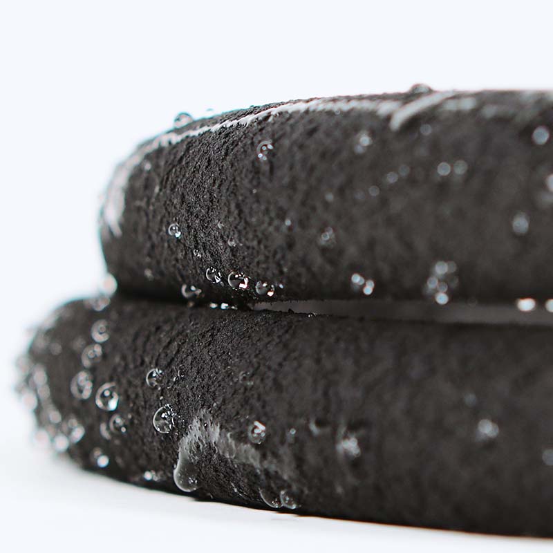 Details of water seeping through soaker hose. Supplies a steady flow of water directly to roots.