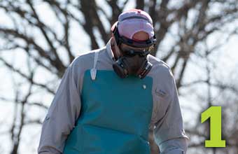 #1 - Man wearing a respirator and protective apron