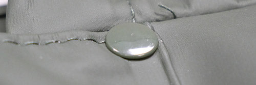 fabric with a rivet-reinforced seam
