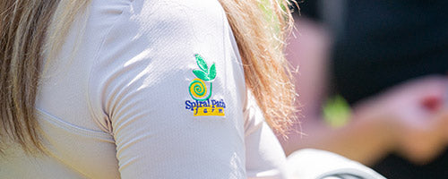 Embroidered logo on shirt sleeve