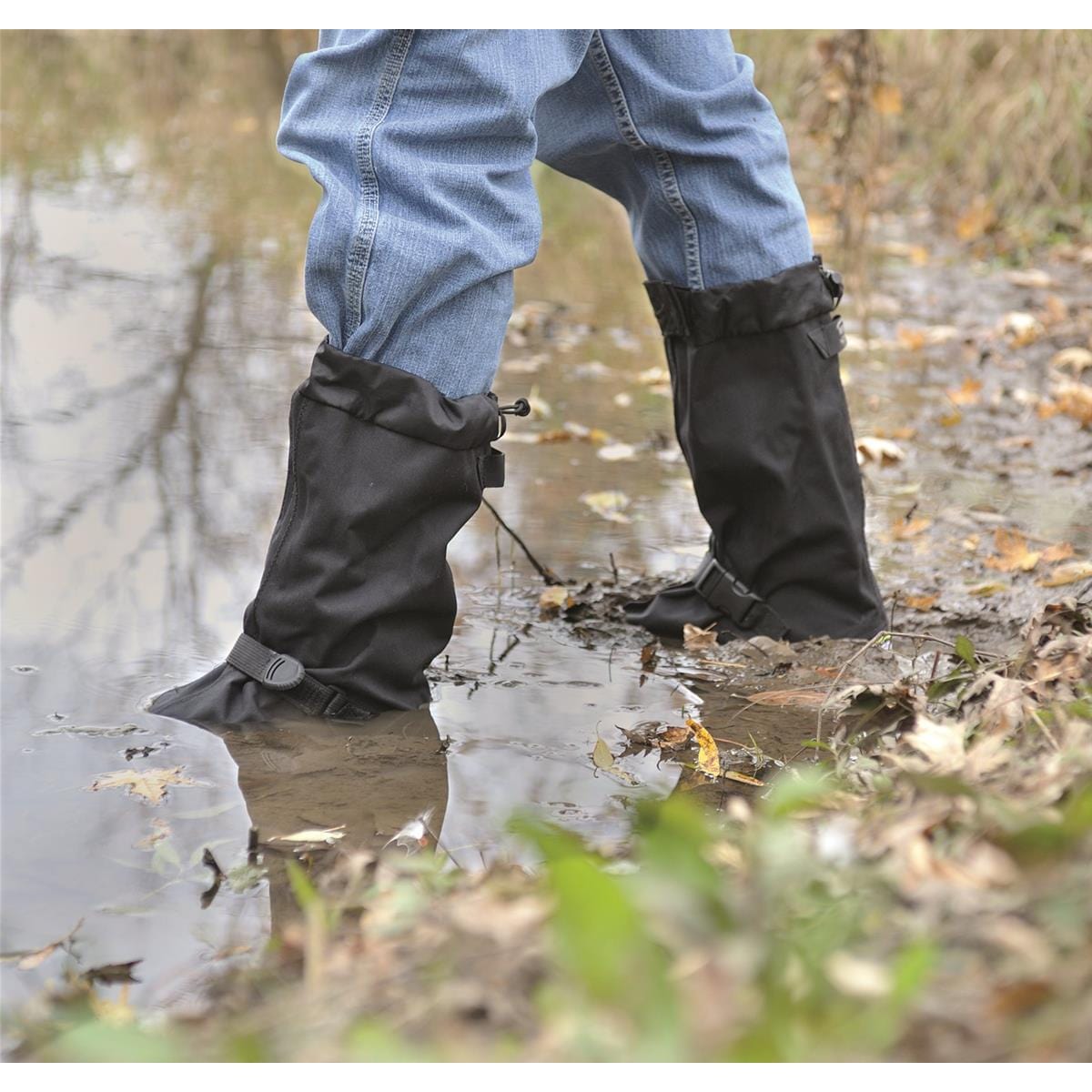 15"H Heavy-Duty Adventurer Overshoes wading into muddy puddle