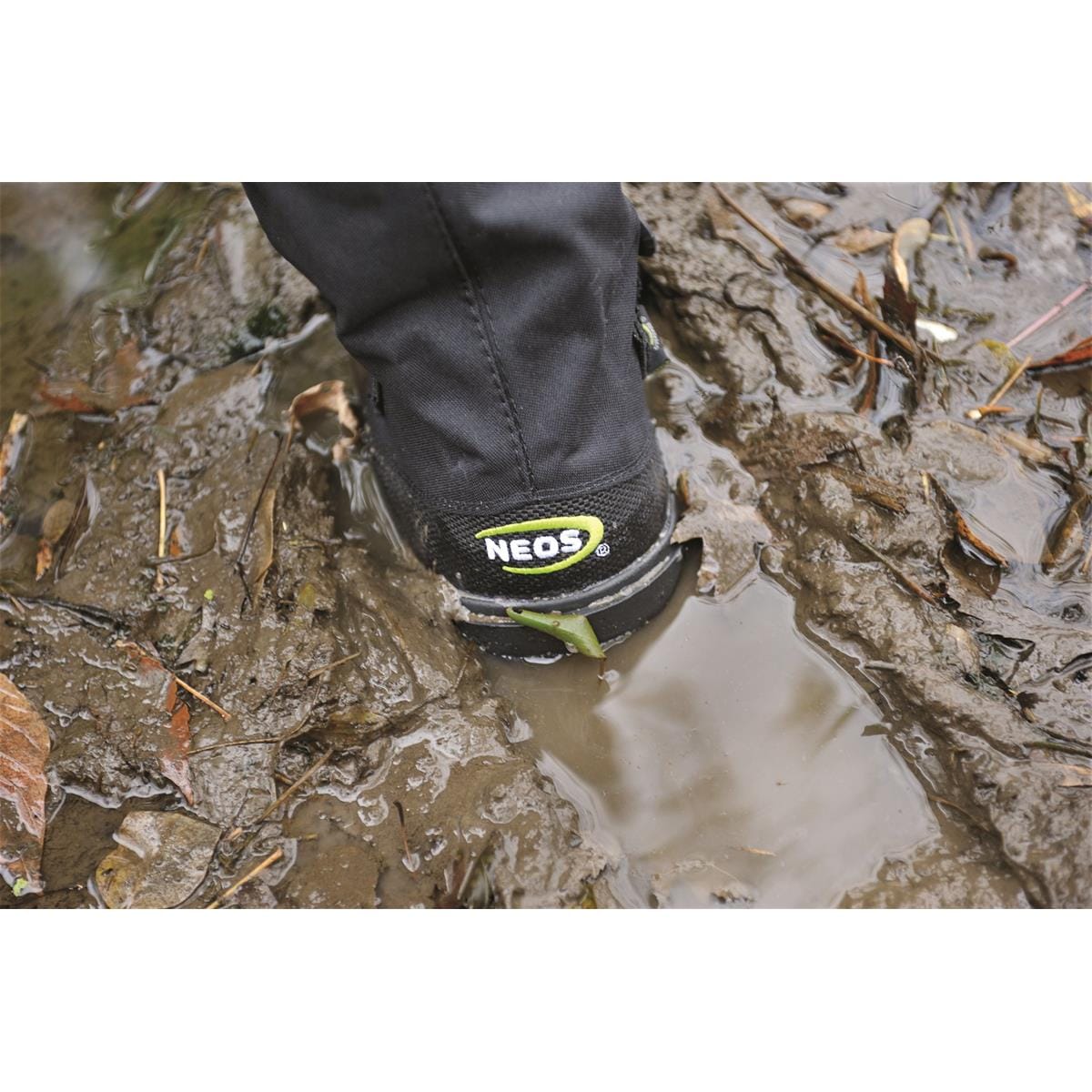 Closeup of 15"H Heavy-Duty Adventurer Overshoes being used in mud