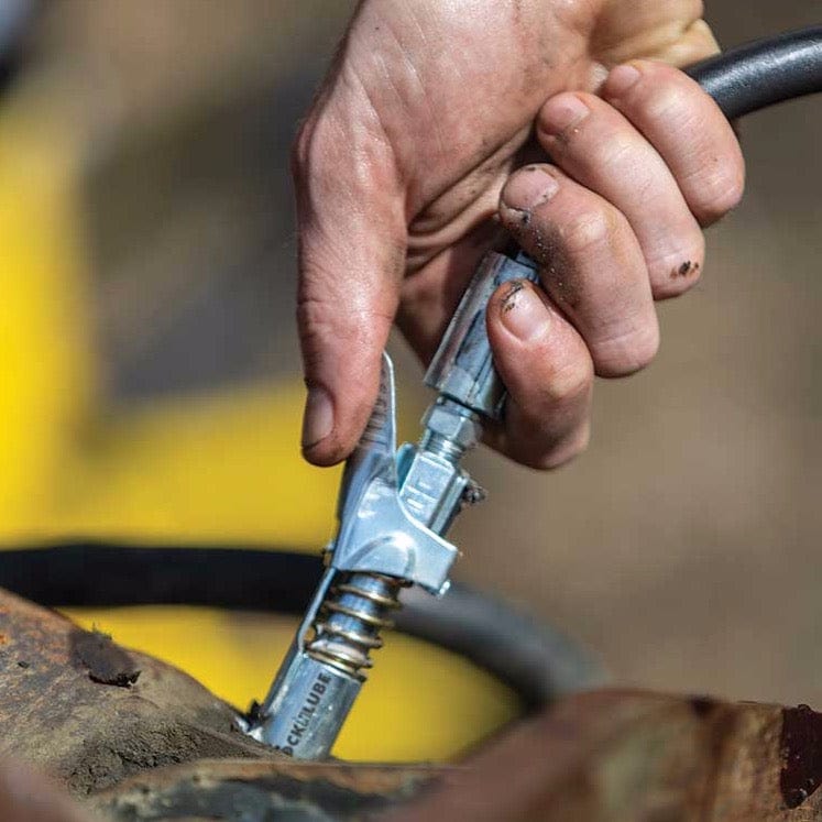 LockNLube® Grease Coupler being used on a piece of equipment