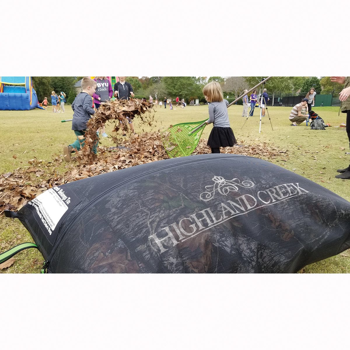 A Custom Leaf Burrito with kids raking leaves in background