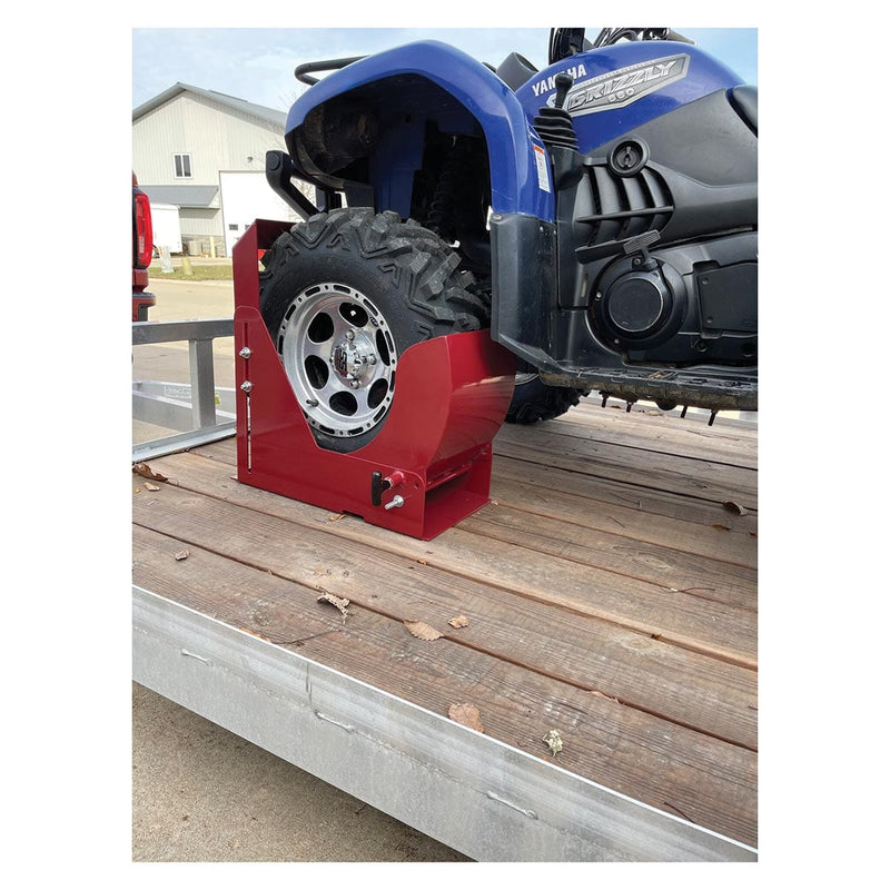 Angled view of the Power Locker Equipment Tie Down being used to secure an ATV on a trailer